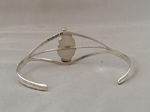A Silver Bear Claw Bracelet Inside