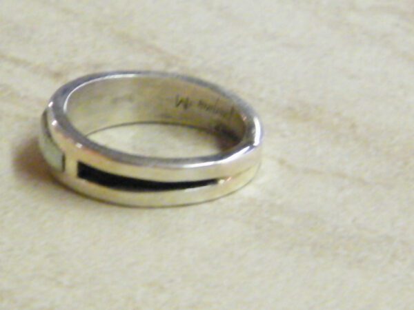 Side view of mens white opal muskett wedding ring