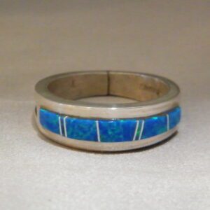 A Silver Ring With Blue Stone and White Lines