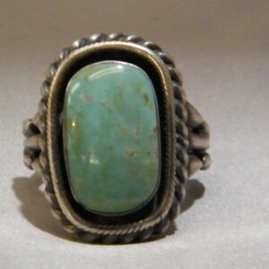 A Silver Color Ring With Oval Teal Color Stone One