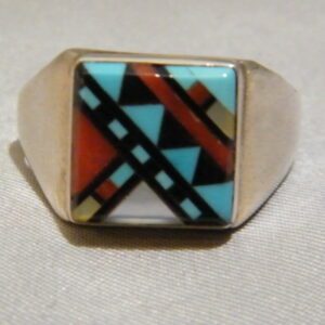 A Silver Ring With Blue, Black and White Square Stone