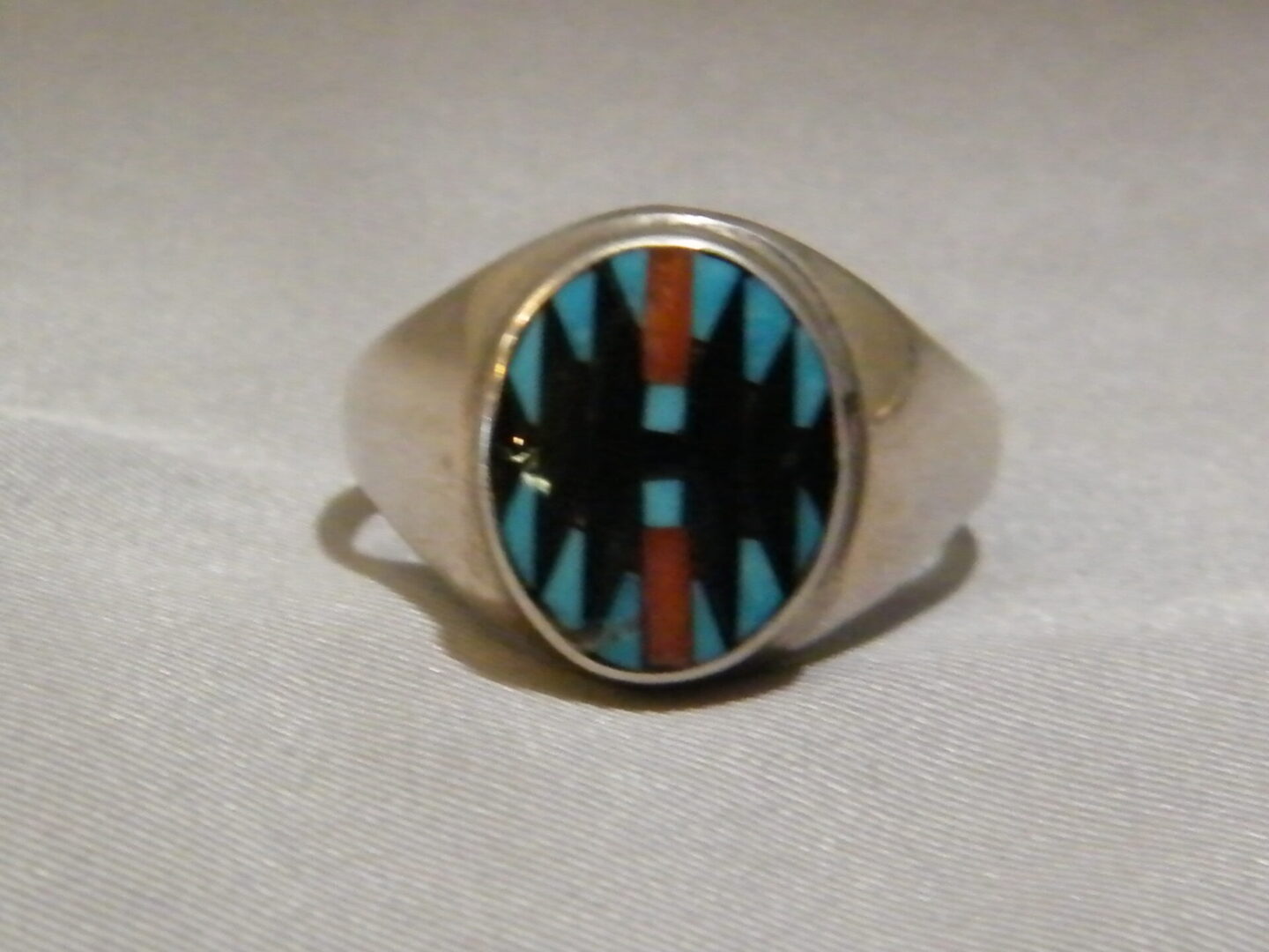 Oval Shaped Ring With Black Stone and Blue and Red Details