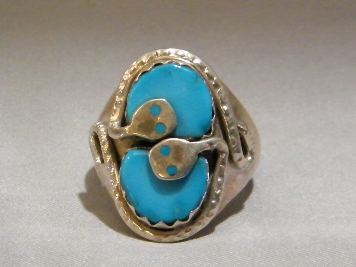 A Blue Color Stone Ring With Snake Pattern