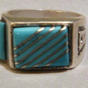A Silver Ring With Blue Stone and Silver Details