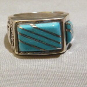 A Silver Color Ring With Blue and Silver Color Stone One