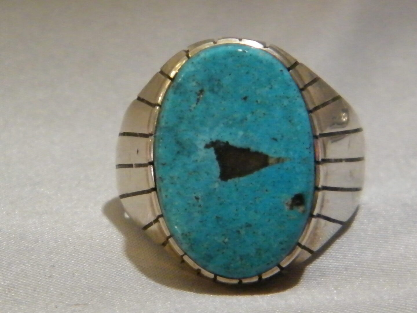 An Oval Shape Turquoise Stone With Sterling Silver