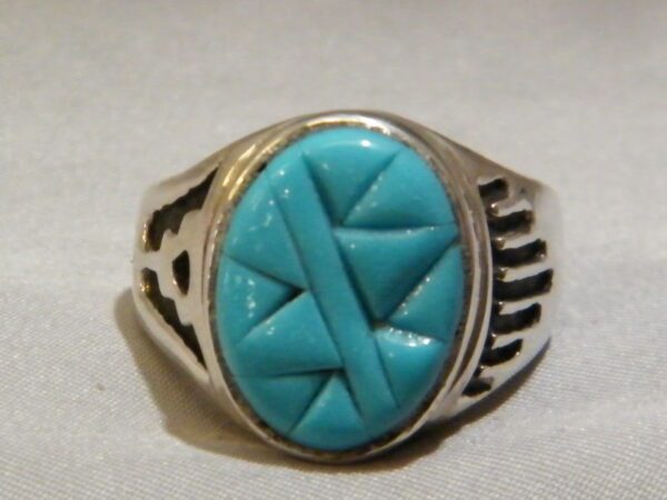 A Sterling Silvers Turquoise Stone Mountain Pattern Ring
